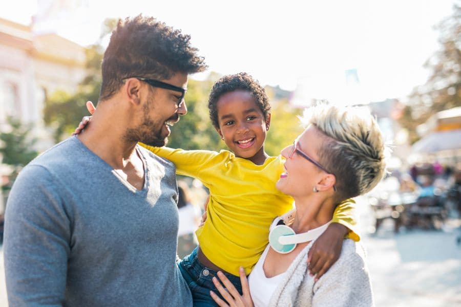 Happy family smiling together outdoors
