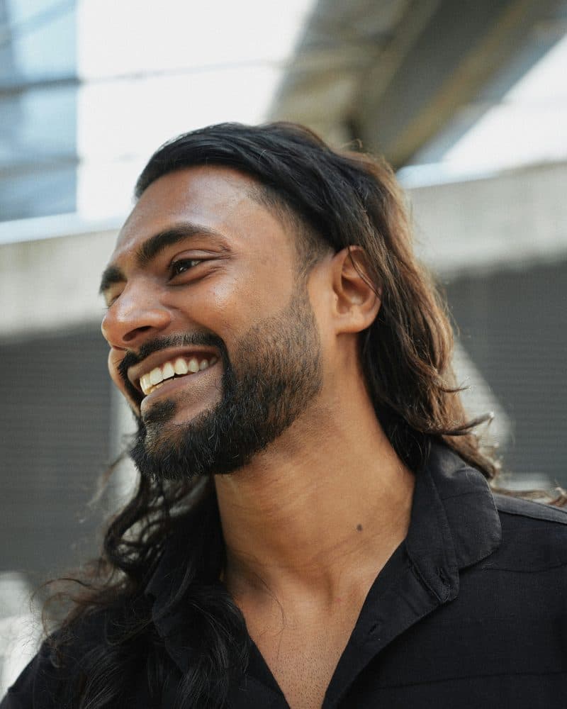 Man smiling, feeling relief after therapy